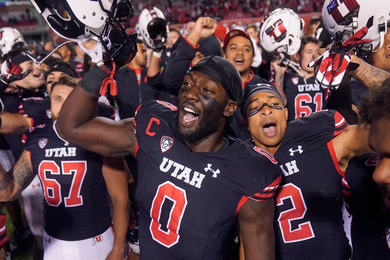 Utah linebacker Devin Lloyd celebrates with teammates following win against Arizona State, Oct. 16, 2021, in Salt Lake City.