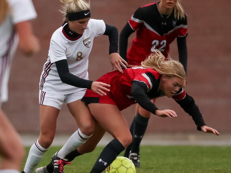 Maple Mountain’s Allie Fryer pushes Alta’s Isabella Woods, leading to a yellow card and followed by a red card.