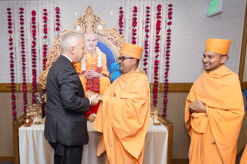 Elder Michael Cziesla, a General Authority Seventy of The Church of Jesus Christ of Latter-day Saints, is greeted by BAPS leadership at the grand opening ceremony held Sept. 13, 2025, for the faith organization's new mandir in Utah.