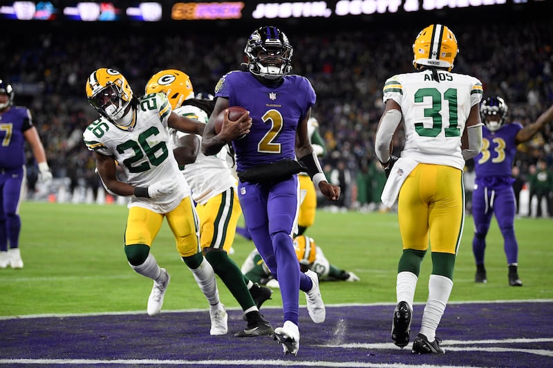 Baltimore quarterback Tyler Huntley scores a touchdown in the second half against the Green Bay Packers, Dec. 19, 2021.