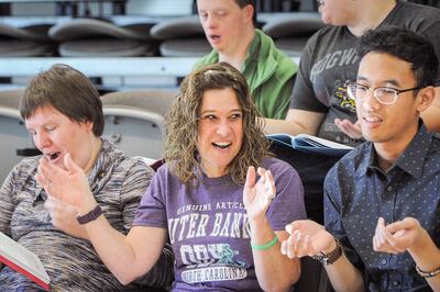 Lauri, enjoying the read through, claps and laughs during a rehearsal of the Elevate Theater Company at the Tanner Dance Building at the University of Utah in Salt Lake on Saturday, Dec. 9, 2017. A local theater program for disabled adults, Elevate Theate