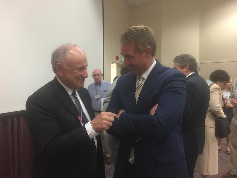 Sen. Jeff Flake, R-Arizona, talks with Bill Atkin, associate general counsel of The Church of Jesus Christ of Latter-day Saints, after Flake's speech at the fourth BYU Religious Freedom Annual Review at the BYU Conference Center in Provo, Utah, on Thursda