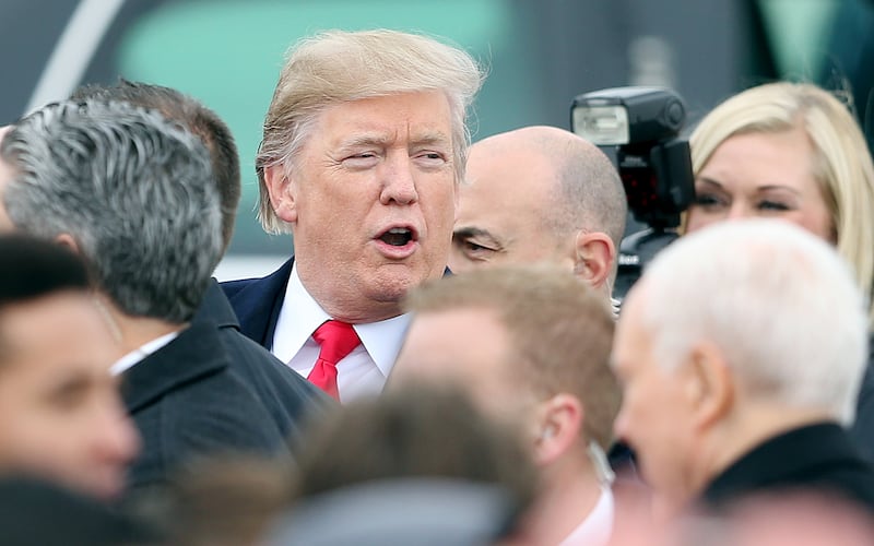 President Donald Trump makes his way to his limousine at Roland R. Wright Air National Guard Base at the Salt Lake City International Airport in on Dec. 4, 2017.