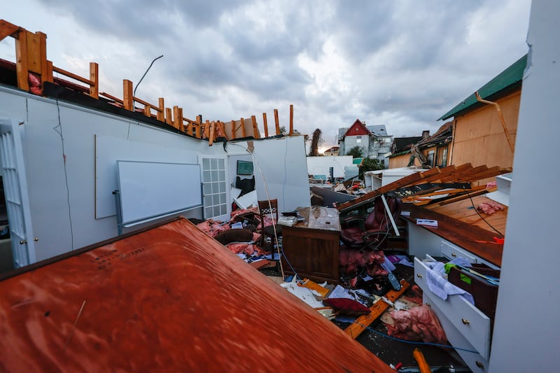 Debris litters a local business that was destroyed by a tornado that passed through downtown Selma.