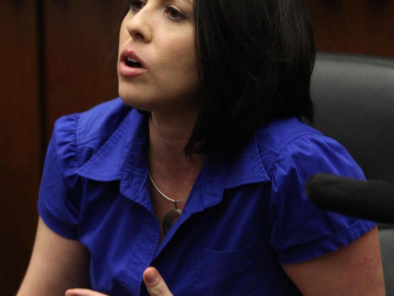 FILE - In this photo taken June 27, 2011, Jessica Hubinek, 32, of Carol Stream, Ill. who was juror 179 in the corruption retrial of former Illinois Gov. Rod Blagojevich, speaks out following the guilty verdict of the former governor at the federal courtho