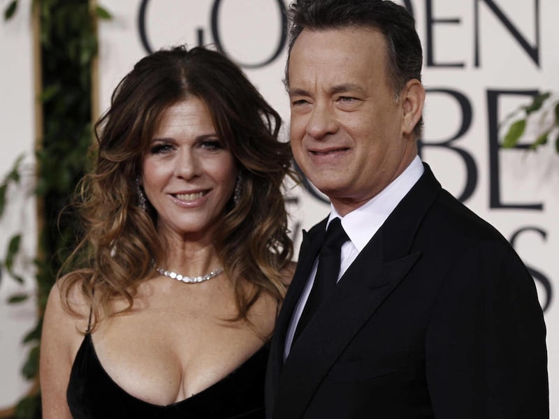 Tom Hanks and his wife Rita Wilson arrive for the Golden Globe Awards Sunday, Jan. 16, 2011, in Beverly Hills, Calif. They were some of the first notable celebrities to catch the COVID-19 virus.