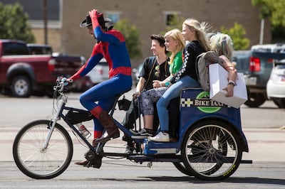 Fans attending FanX Salt Lake Comic Convention take a pedicab at the Salt Palace Convention Center in Salt Lake City on Saturday, Sept. 8, 2018.