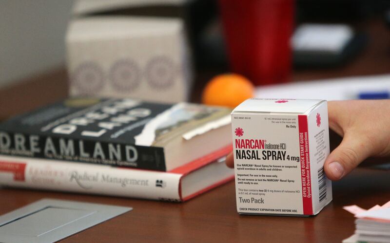 Carbon County Commissioner Jake Mellor picks up a box of Narcan in his office in Price on Tuesday, Dec. 19, 2017. Carbon County is facing an opioid epidemic.