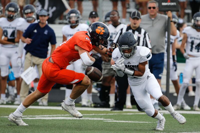 Syracuse’s Dashaun Wise, right, misses a pass while getting pressured by Brighton’s Lander Barton during a high school football game, Saturday, Aug. 21, 2021 at Corner Canyon High in Draper.
