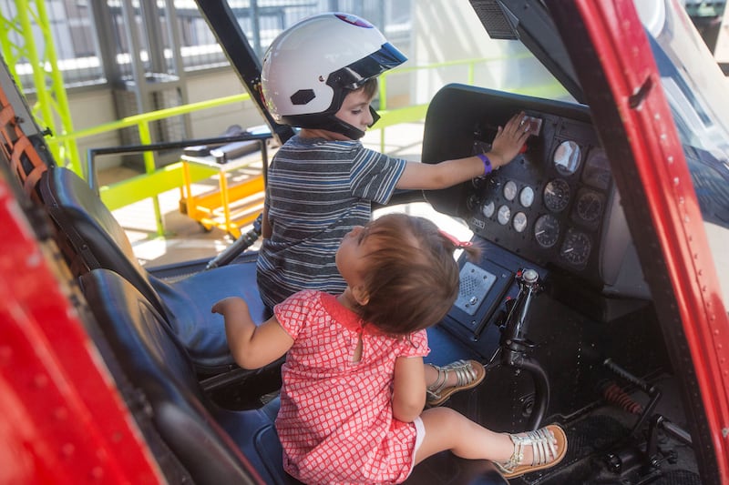 J Heritage, 5, left, and Sienna Heritage, 1, play in the helicopter on the day of the grand opening of the extension to the Intermountain Life Flight exhibit at the Discovery Gateway Children's Museum in Salt Lake City on Saturday, June 24, 2017. On Oct.