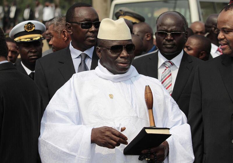 FILE - In this June 30, 2011 file photo, Gambian President Yahya Jammeh stands outside the Sipopo Conference Center in Malabo, Equatorial Guinea, ahead of the opening session of the 17th African Union Summit. A movement to coronate President Jammeh as Kin