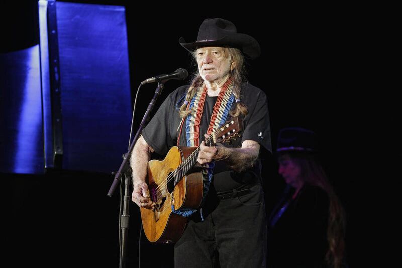 FILE - In this Sunday, Jan. 29, 2012 file photo, country music icon Willie Nelson performs during a fundraising concert for U.S. Rep. Dennis Kucinich in Lorain, Ohio. Nelson's new album, "Heroes," released May 15, 2012, is a collection of songs sung with