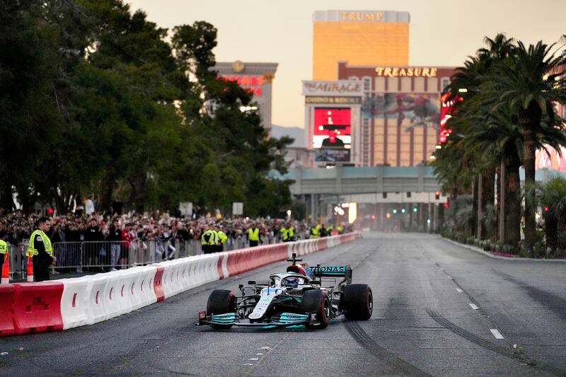 George Russell drives during a demonstration along the Las Vegas Strip at a launch party for the F1 Las Vegas Grand Prix.