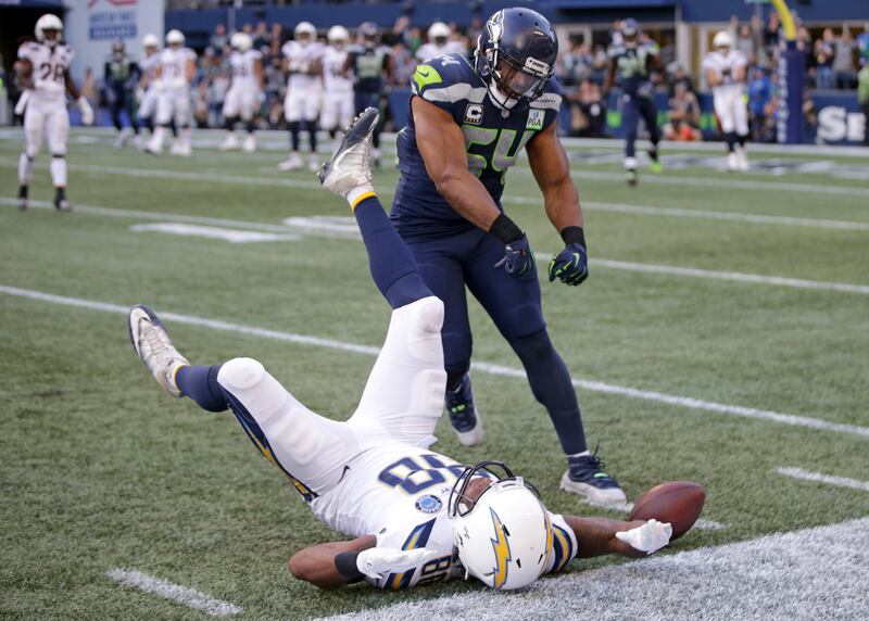 Seattle Seahawks' Bobby Wagner (54) reacts after breaking up a pass intended for Los Angeles Chargers' Virgil Green during the second half of an NFL football game, Sunday, Nov. 4, 2018, in Seattle.