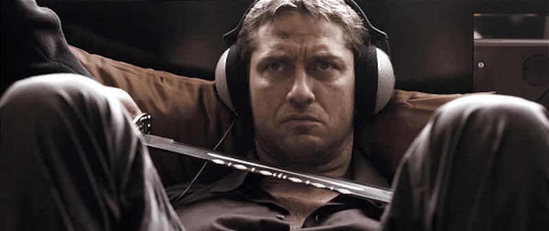 Gerard Butler stars as One Two in the action film "RocknRolla."