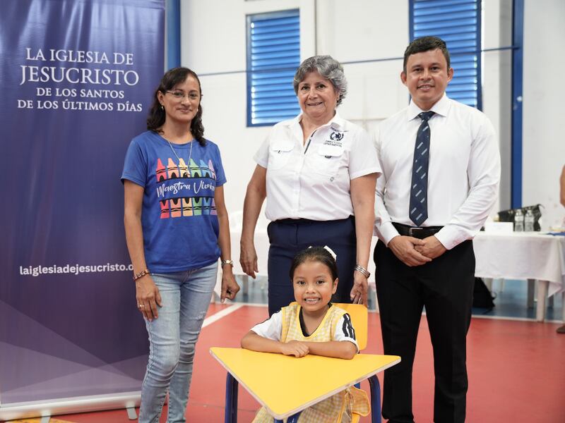 San Felipe Guatemala Stake President Rony Estuardo Estrada, right, pauses for a photo with departmental director of education Mara Judith Landaverde, middle, and individuals who will benefit from the donations in Retalhuleu, Guatemala, on July 23, 2025.
