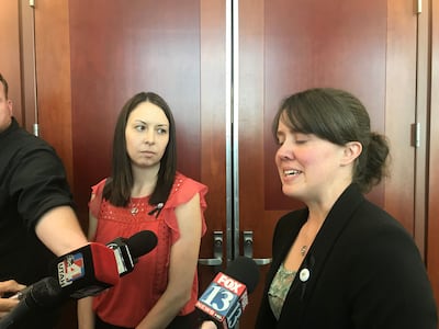 Jessica Knorr, left, and Katie Merrill talk about their mom, West Valley code enforcement officer Jill Lanette Robinson, after Kevin Wayne Billings, the man who shot and killed her, was sentenced to life in prison without the possibility of parole at the
