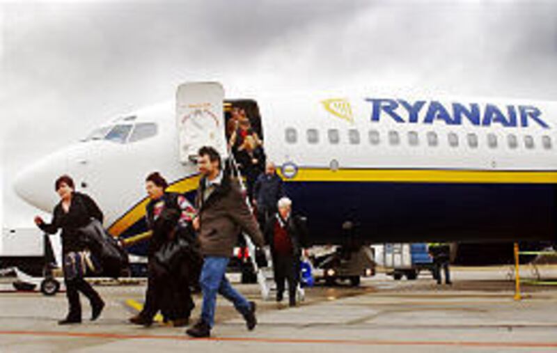 Passengers step off of a Ryanair flight at Brussels South airport in nearby Charleroi, Belgium. The no-frills airline is testing the Spartan spirit of its passengers.