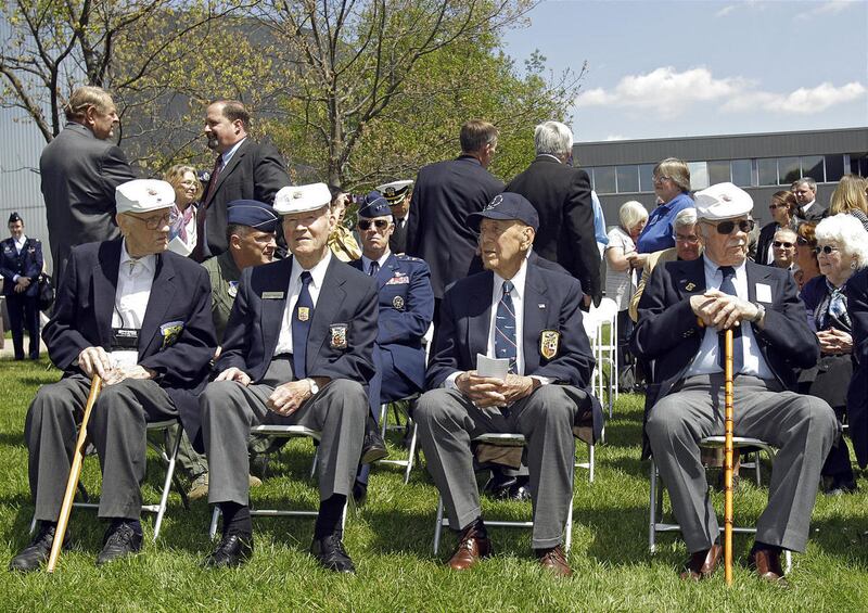 FILE - In this Wednesday, April 18, 2012 photo, four of the five surviving members of the Doolittle Raiders, front row from left: Thomas C. Griffin, David J. Thatcher, Richard E. Cole and Edward J. Saylor, sit during a reunion at the National Museum of th