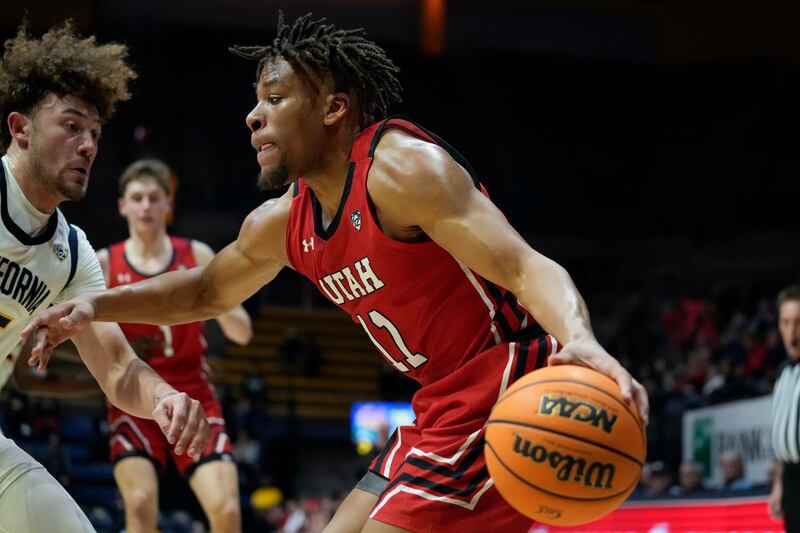 Utah guard Wilguens Exacte drives to the basket against California in Berkeley, Calif., Thursday, Dec. 29, 2022.
