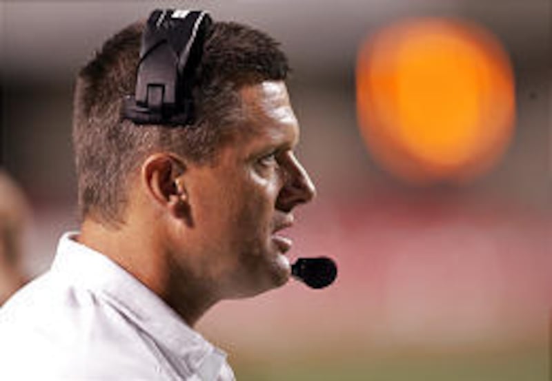Both BYU and Utah want Kyle Whittingham, Ute defensive coordinator, as head coach.
