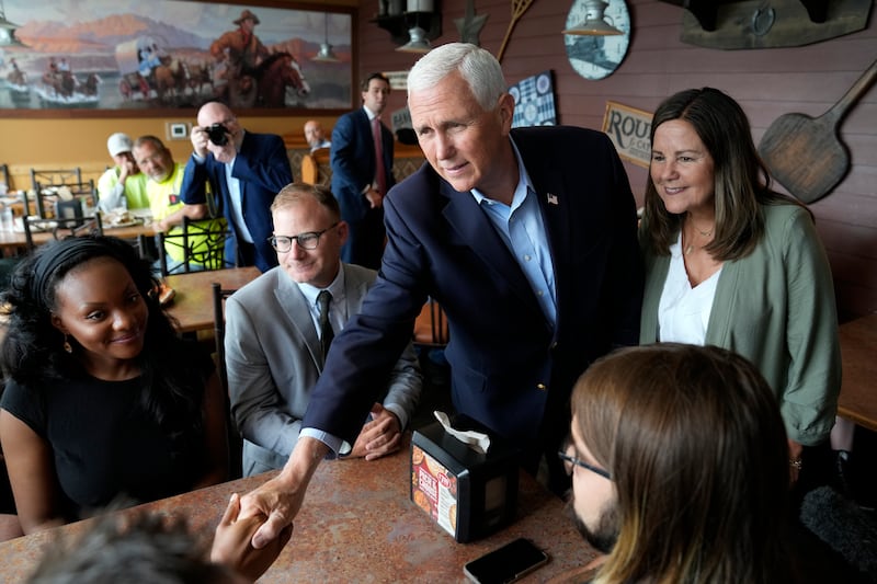 Republican presidential candidate Mike Pence talks with supporters during a stop on June 8, 2023, in Waukee, Iowa.