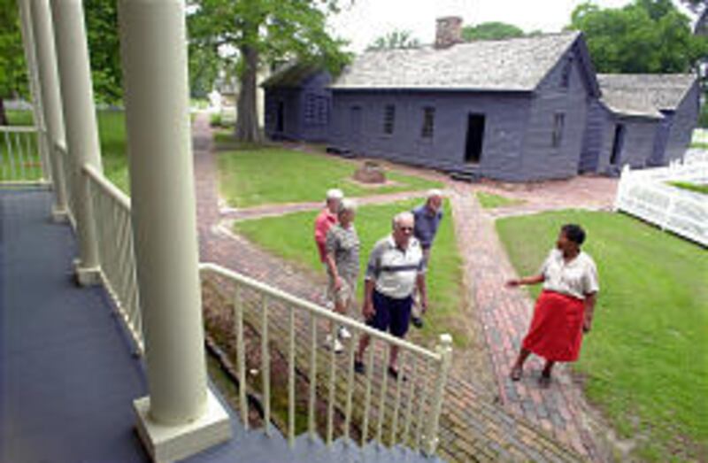 Tour manager Dot Redford, right, leads visitors to Somerset Place through the grounds of the historic plantation near Creswell, N.C.