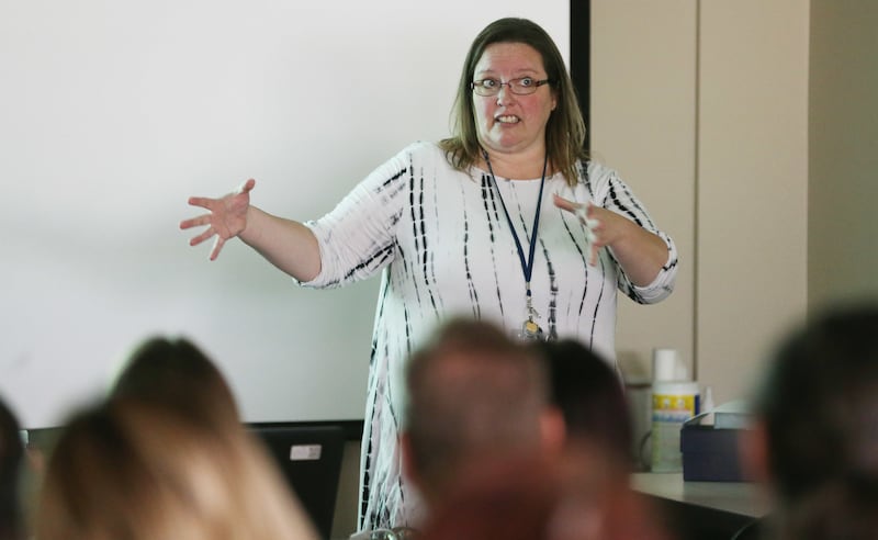 Office of Recovery Services director Liesa Stockdale speaks with staff in Salt Lake City on Saturday, Aug. 11, 2018. The department is tasked with improving child support payments in the state.
