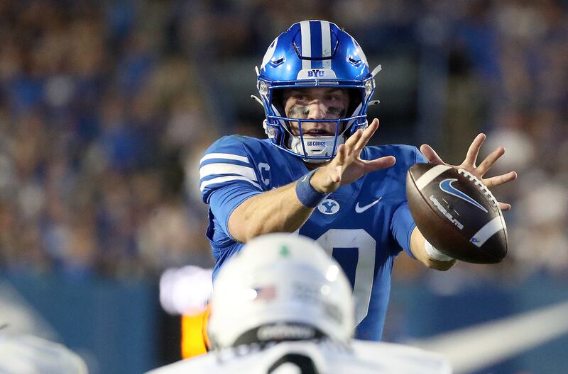 BYU quarterback Kedon Slovis takes a snap during game against Cincinnati at LaVell Edwards Stadium in Provo on Friday, Sept. 29, 2023.