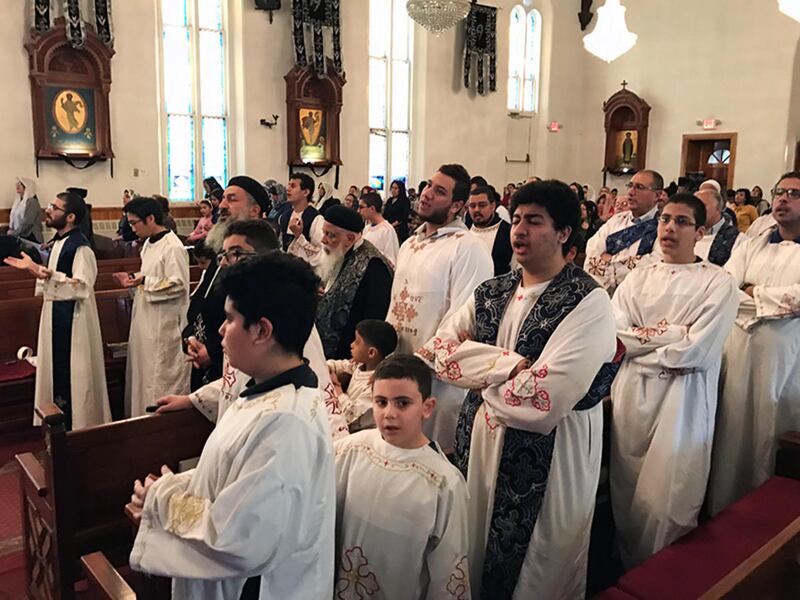 Clergy, deacons and the deacon choir participate in a Holy Week service at the Coptic Orthodox Church of St. Mark on Monday, April 10, 2017, in Jersey City, N.J. Two Coptic Christian churches were bombed in Egypt on Palm Sunday, the day before.