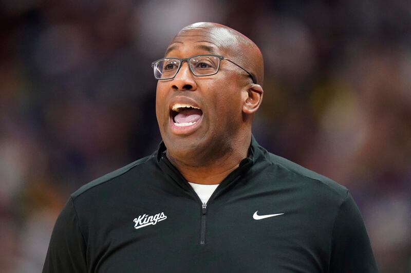 Sacramento Kings coach Mike Brown shouts to players