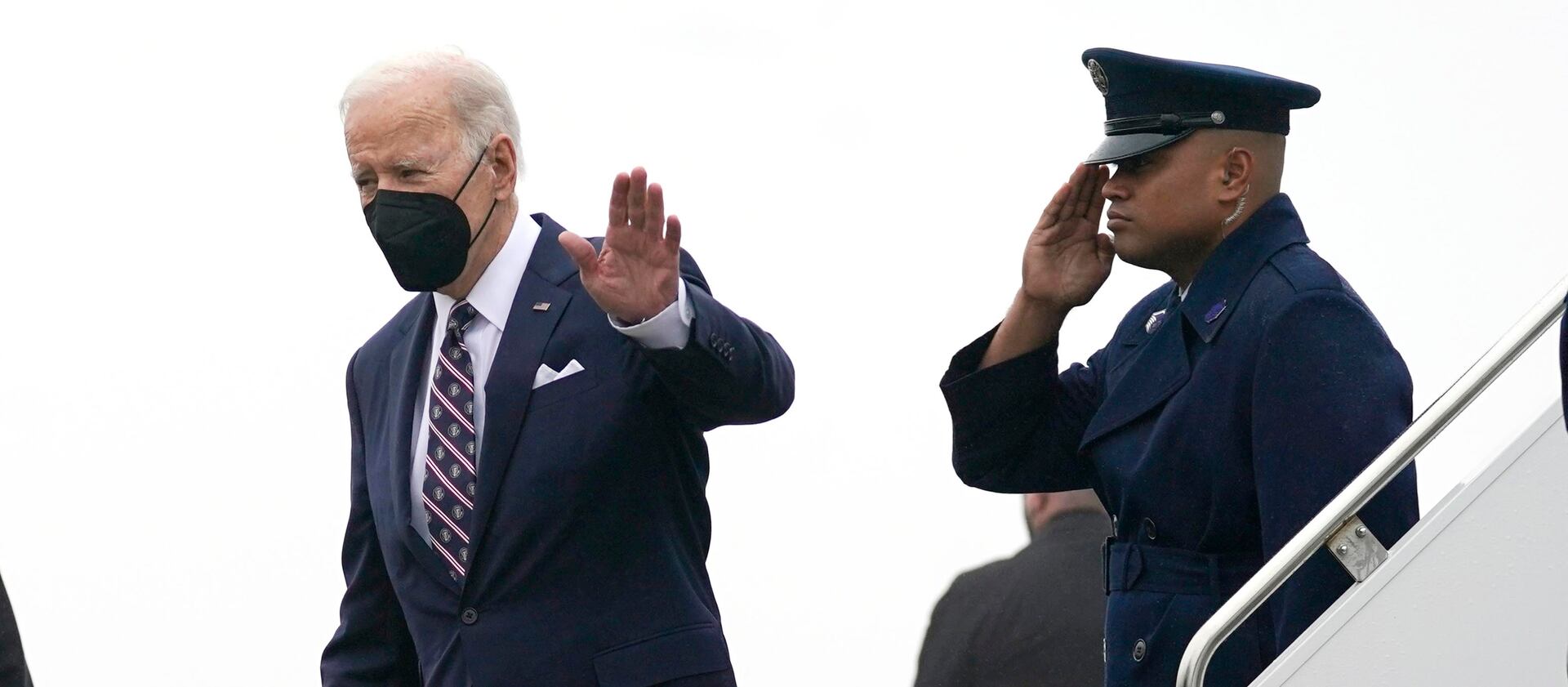 President Joe Biden waves as he steps off Air Force One upon arrival at John F. Kennedy Airport.