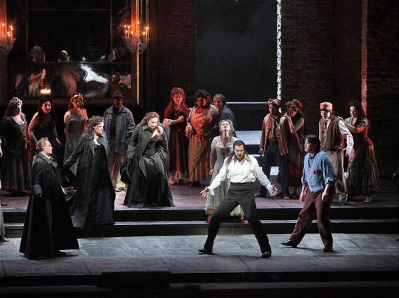 Foreground from left, Pavol Breslik as Don Ottavio, Erin Wall as Donna Anna, Barbara Frittoli as Donna Elvira, Isabel Bayrakdarian as Zerlina, Peter Mattei as Don Giovanni and Shenyang as Masetto, perform in Mozart's "Don Giovanni" at the Metropolitan Op