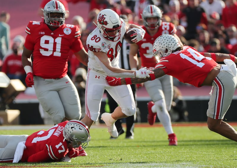 Utah tight end Brant Kuithe picks up a first down on a catch-and-run during Rose Bowl game against Ohio State in Pasadena.