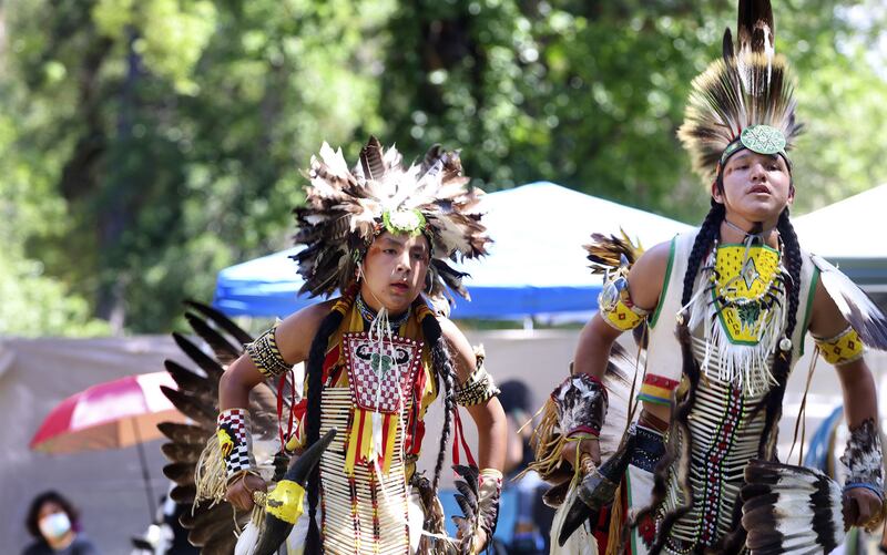 Stephan Brown and Nakoa Kakakaway, both from McDermott, Nevada, dance during the 28th Annual Intertribal Powwow in Liberty Park in Salt Lake City on Saturday.