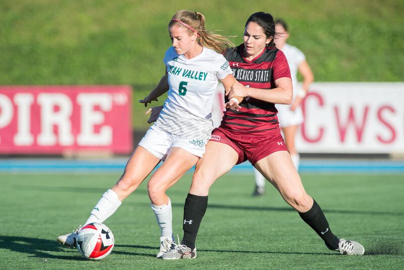 UVU midfielder Breanna DeWaal (left-center) gathers the ball against a New Mexico State defender last season at the WAC Tournament in Kansas City, Missouri.