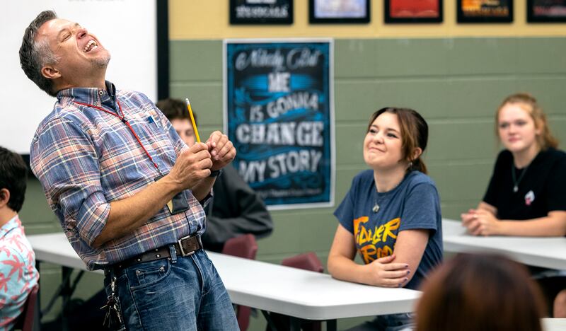 Weber High School theater teacher Mark Daniels laughs as he teaches a beginning theater class.