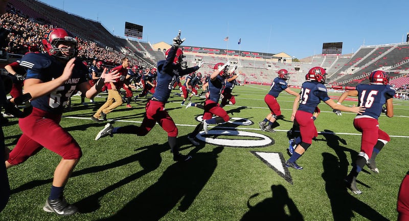 Herriman celebrate their win over Sky View in the 5A high school state semifinal football game at Rice-Eccles Stadium in Salt Lake City Friday, Nov. 13, 2015.