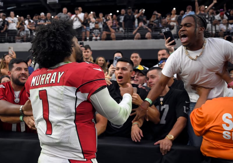 Arizona Cardinals quarterback Kyler Murray (1) celebrates with fans after an NFL football game against the Las Vegas Raiders, Sunday, Sep 18, 2022, in Las Vegas. Las Vegas police said they’re investigating allegations that a fan in the stands attacked Murray after Arizona’s 29-23 overtime victory over the Raiders.