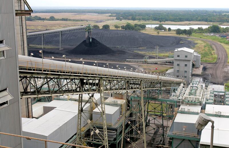 **FILE ** Coal is transported up a conveyor belt into the TXU Corp’s Big Brown coal-fired power plant in this Aug. 24, 2006 file photo, near Fairfield, Texas. TXU Corp., Texas’ largest electricity producer, said Monday, Feb. 26, 2007 it has agreed to be sold to a group of private-equity firms for about $32 billion in what would be the largest private buyout in U.S. corporate history if shareholders go along. (AP Photo/David J. Phillip)