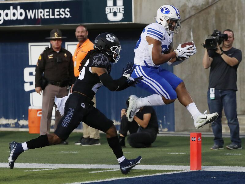 Brigham Young Cougars running back Tyler Allgeier scores on Utah State Aggies in Logan on Friday, Oct. 1, 2021.