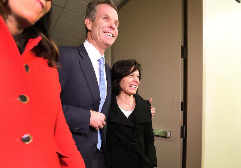 FILE - Former Utah Attorney General John Swallow and his wife, Suzanne, leave the Matheson Courthouse in Salt Lake City after a jury found him not guilty on all counts in his public corruption trial on Thursday, March 2, 2017. Swallow has mobilized a free