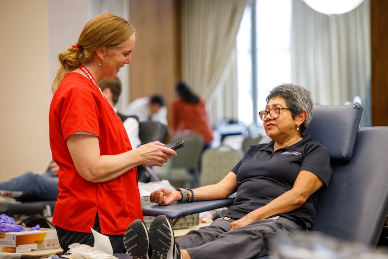 An American Red Cross worker visits with a donor at a blood drive sponsored by The Church of Jesus Christ of Latter-day Saints. The drive was held at the Church Office Building in Salt Lake City, Utah, on June 14, 2023.