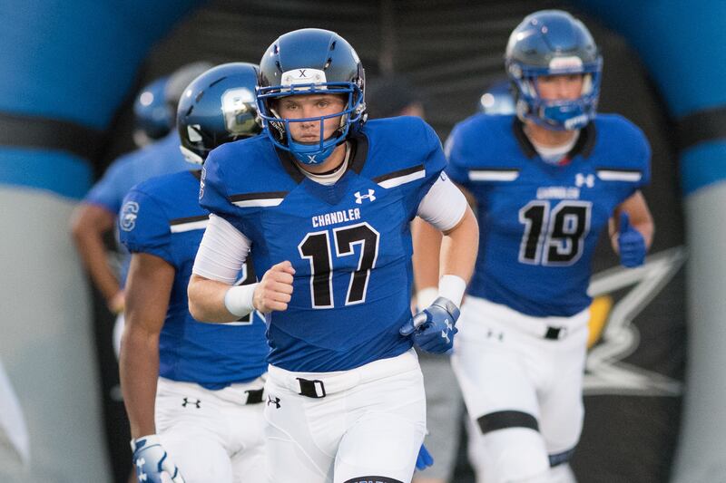 Chandler High quarterback Jacob Conover, who verbally committed to play for BYU, runs on to the field prior to the Wolves' game against Mesa High in Chandler, Arizona, on Friday, Aug. 31, 2018.