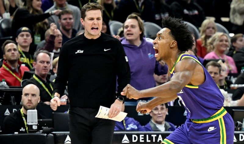Utah Jazz guard Collin Sexton and Jazz coach Will Hardy celebrate after Sexton forces a backcourt turnover.
