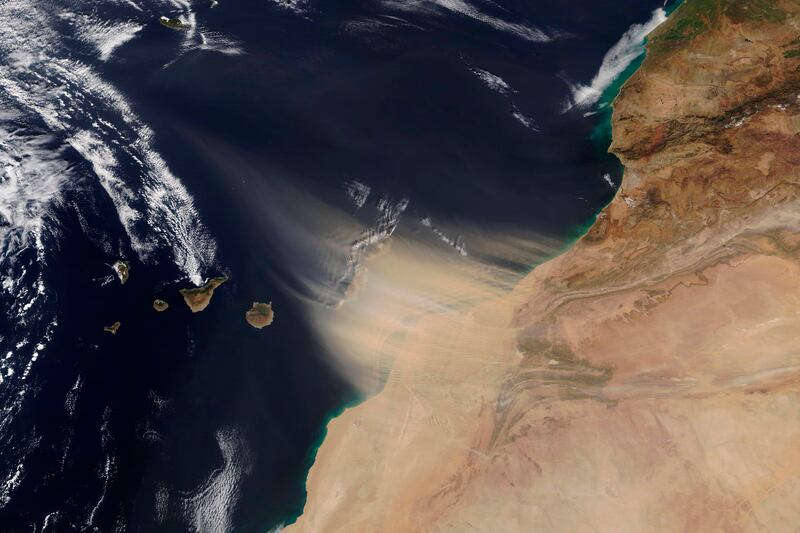 A dust storm approaching the Canary Islands, center, off the coast of Morocco.