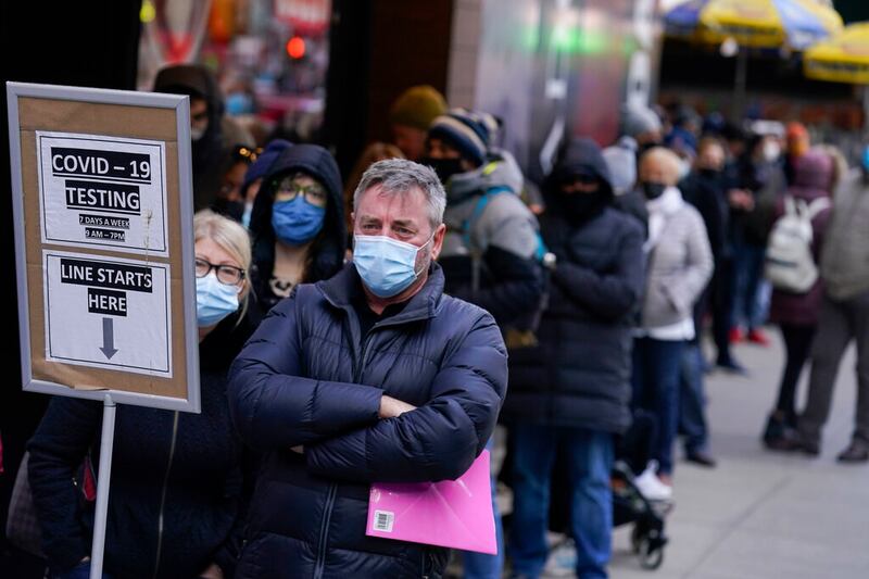 People wait in line at a COVID-19 testing site in New York City.