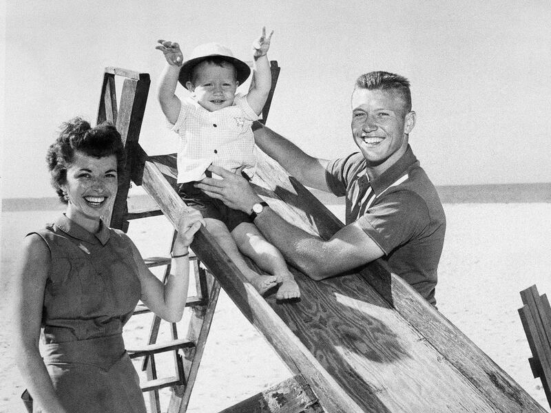 Baseball Hall of Famer Mickey Mantle enjoys a day at the beach with his family.