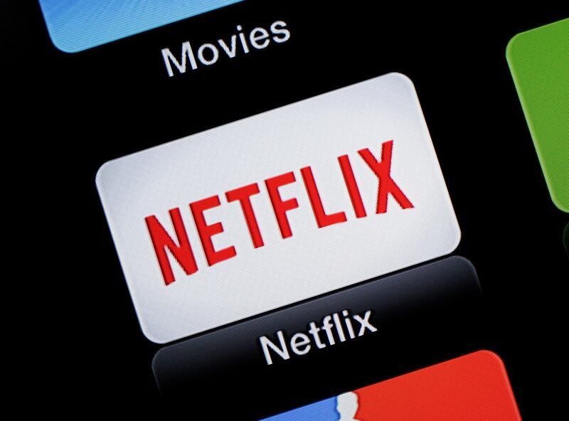 This June 24, 2015, file photo, shows the Netflix Apple TV app icon, in South Orange, N.J. Netflix reports financial results on Monday, April 18, 2016. Sports are on hold, movie theaters are closed and so are amusement parks. But Americans held captive at home by the coronavirus can turn to Netflix, Amazon, Hulu and other streaming services, outliers in an entertainment industry otherwise brought to an unprecedented standstill. (AP Photo/Dan Goodman, File)