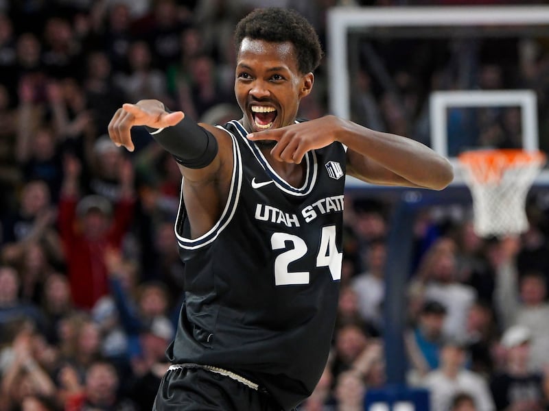 Utah State forward Zee Hamoda (24) celebrates after making a 3-pointer against Westminster Thursday, Dec. 15, 2022, in Logan.